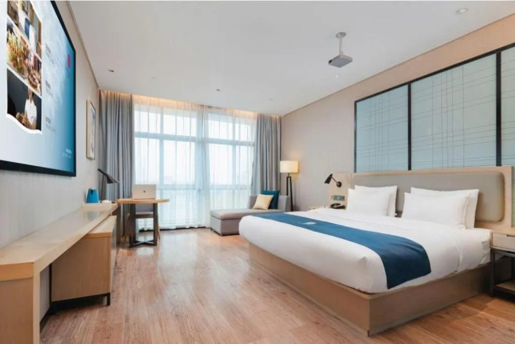 Bed in Echarm Hotel Liuzhou Liunan Wanda Plaza