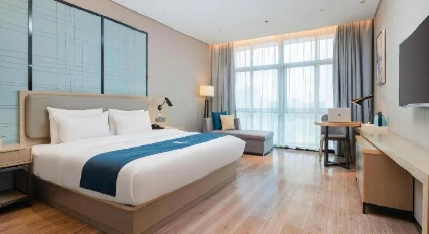 Bed in Echarm Hotel Liuzhou Liunan Wanda Plaza
