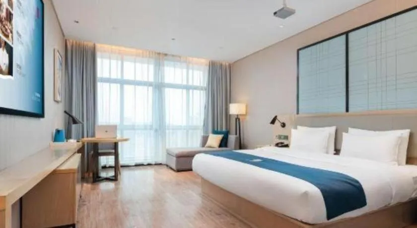 Bed in Echarm Hotel Liuzhou Liunan Wanda Plaza
