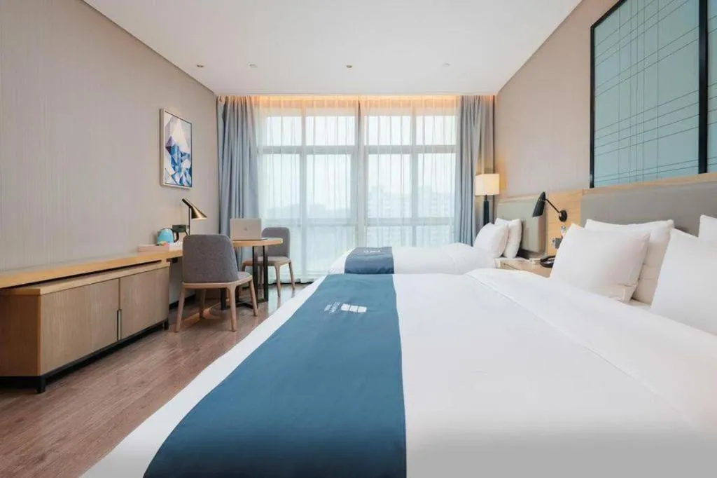 Bed in Echarm Hotel Liuzhou Liunan Wanda Plaza