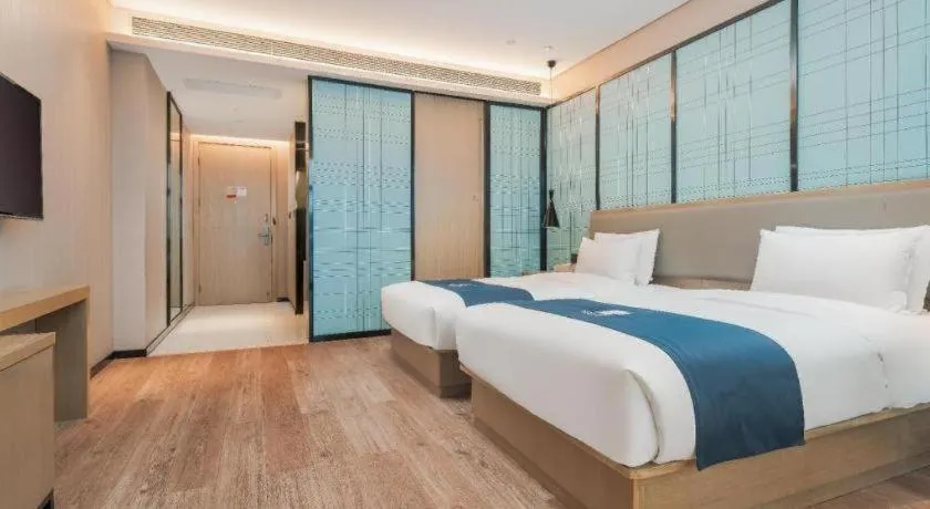 Bed in Echarm Hotel Liuzhou Liunan Wanda Plaza