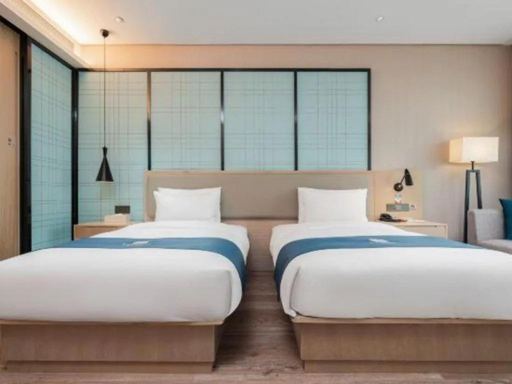 Bed in Echarm Hotel Liuzhou Liunan Wanda Plaza