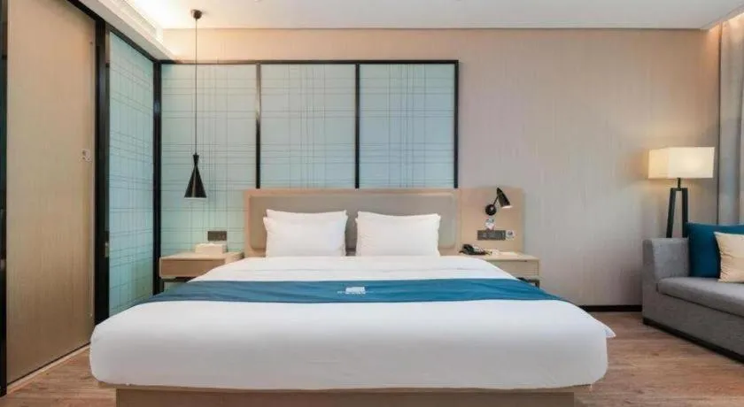 Bed in Echarm Hotel Liuzhou Liunan Wanda Plaza