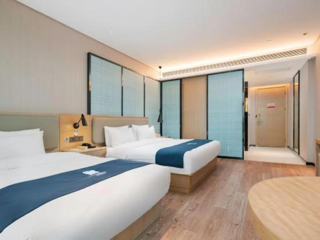 Bed in Echarm Hotel Liuzhou Liunan Wanda Plaza