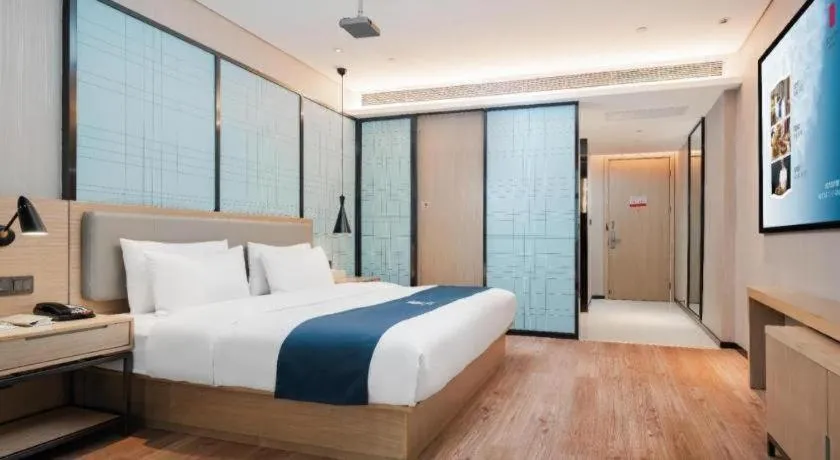 Bed in Echarm Hotel Liuzhou Liunan Wanda Plaza