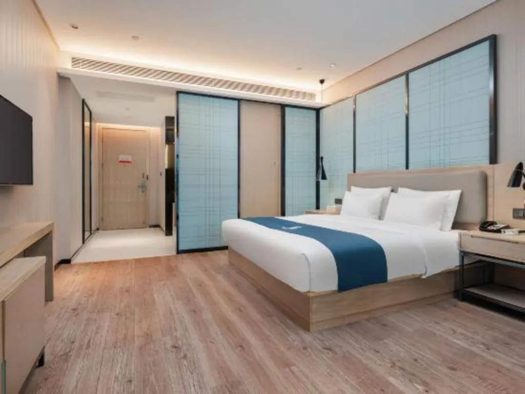 Bed in Echarm Hotel Liuzhou Liunan Wanda Plaza