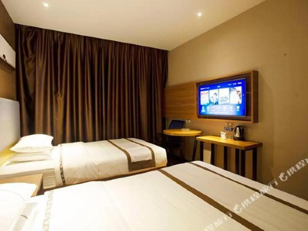 Bed in Jtour Inn Huanggang Wuxue City Square
