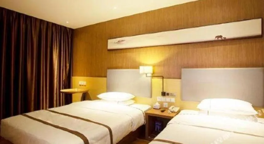 Bed in Jtour Inn Huanggang Wuxue City Square