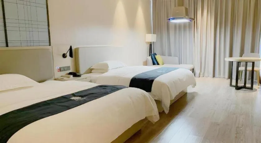 Bed in Echarm Hotel Yiyang Wanda Plaza