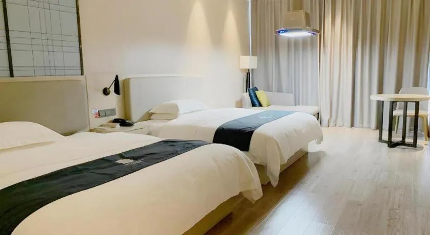 Bed in Echarm Hotel Yiyang Wanda Plaza