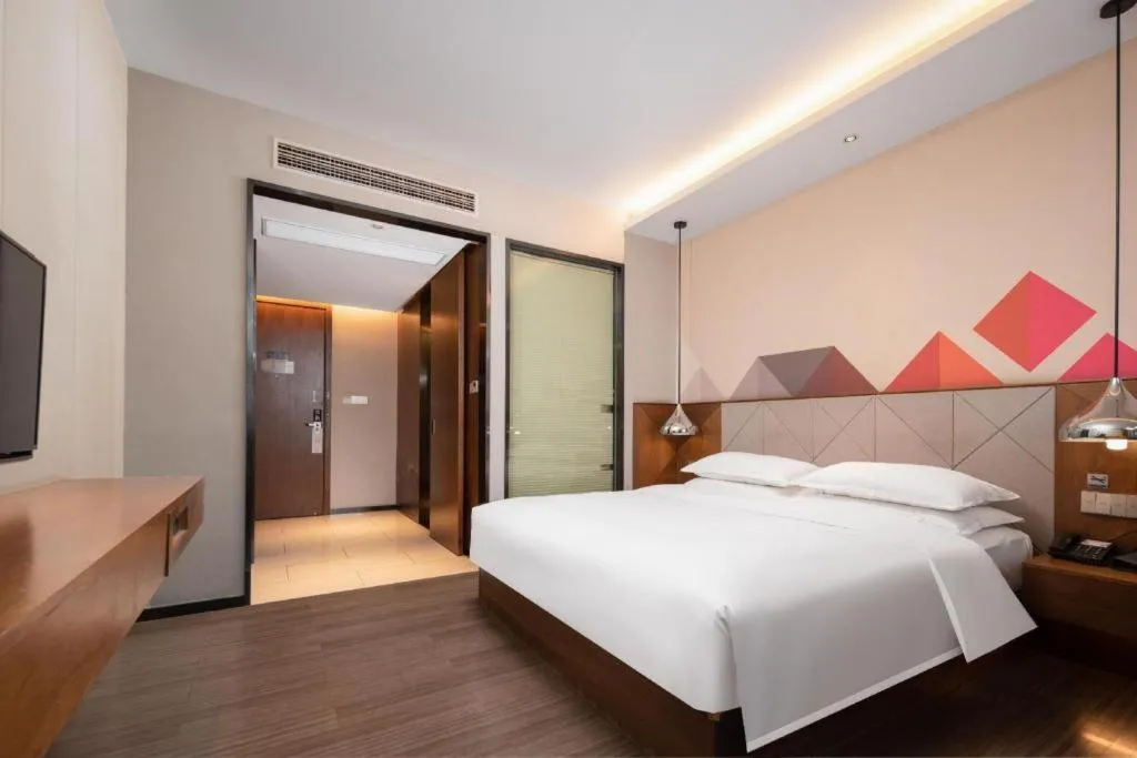 Bed in Borrman Hotel Qianjiang High-speed Railway Station Lobster City