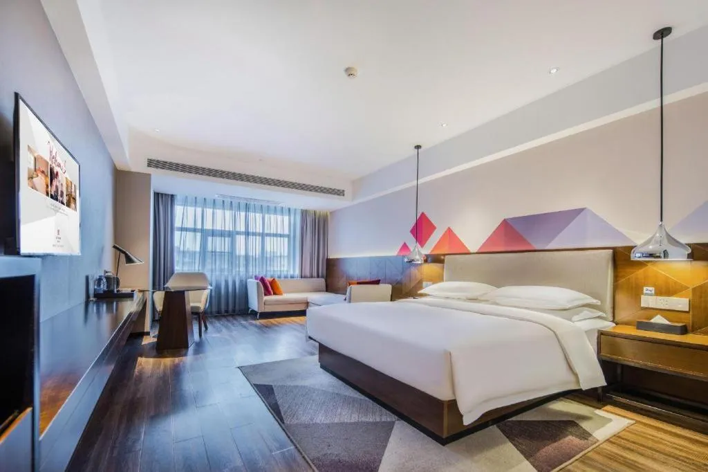 Bed in Borrman Hotel Qianjiang High-speed Railway Station Lobster City