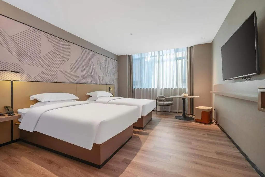 Bed in Borrman Hotel Qianjiang High-speed Railway Station Lobster City