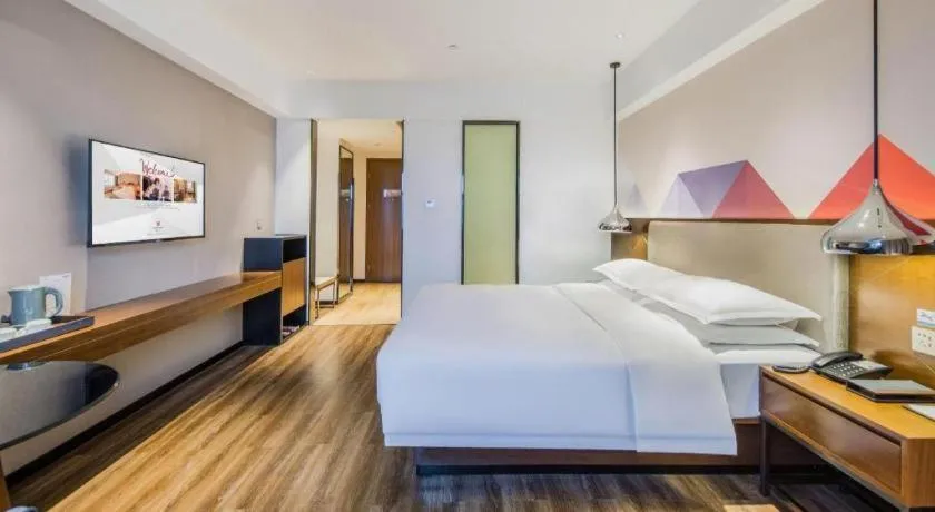 Bed in Borrman Hotel Qianjiang High-speed Railway Station Lobster City