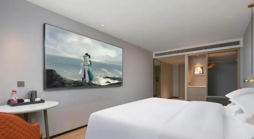 Bed in Borrman Hotel Qianjiang High-speed Railway Station Lobster City