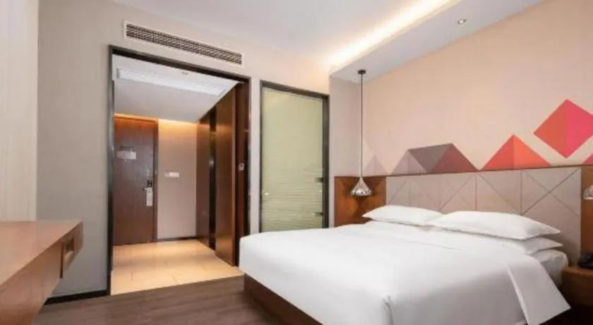 Bed in Borrman Hotel Qianjiang High-speed Railway Station Lobster City