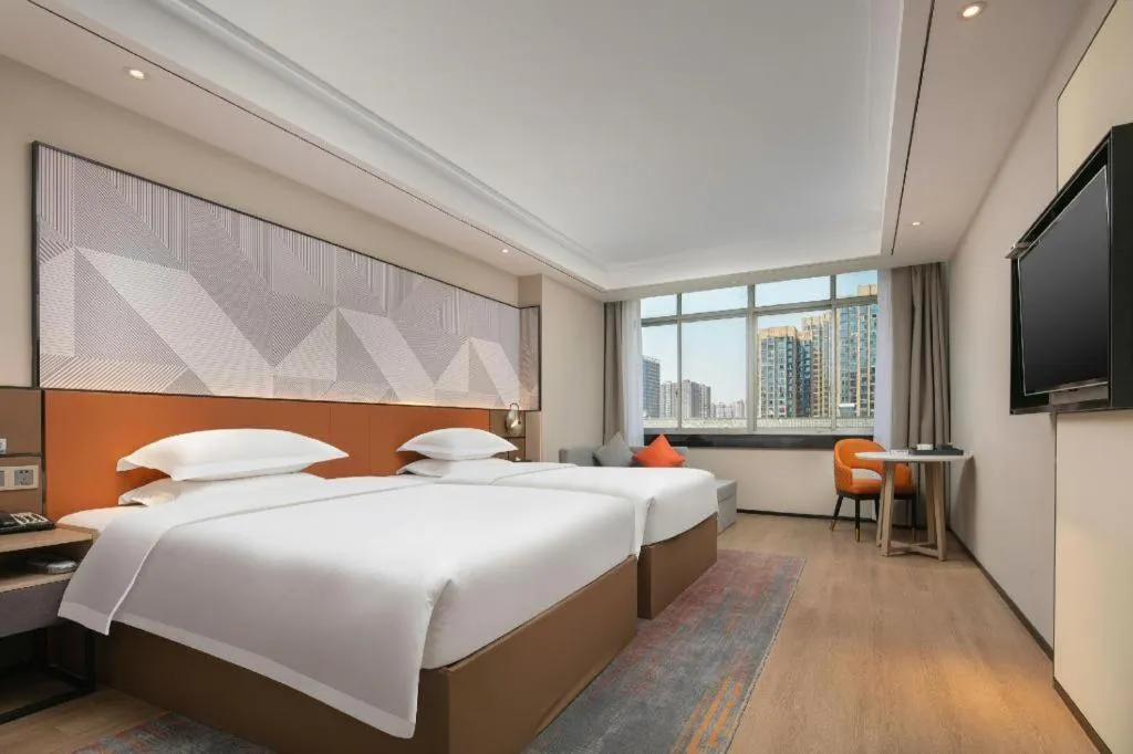 Bed in Borrman Hotel Qianjiang High-speed Railway Station Lobster City