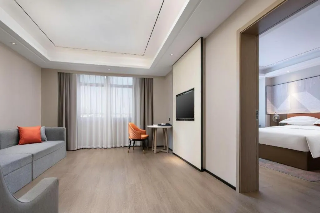 Bed in Borrman Hotel Qianjiang High-speed Railway Station Lobster City