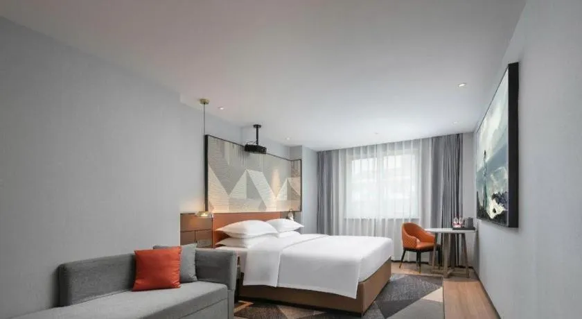 Bed in Borrman Hotel Qianjiang High-speed Railway Station Lobster City