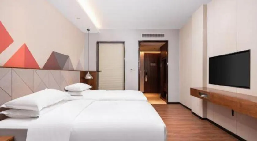 Bed in Borrman Hotel Qianjiang High-speed Railway Station Lobster City