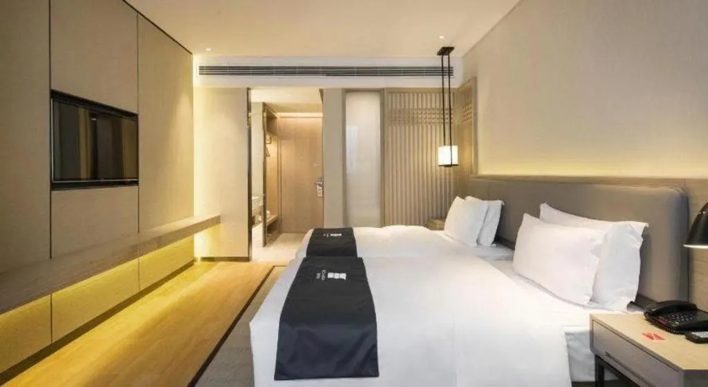 Bed in Echarm Hotel Changsha Gaoqiao