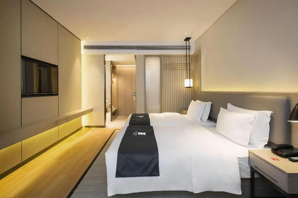 Bed in Echarm Hotel Changsha Gaoqiao