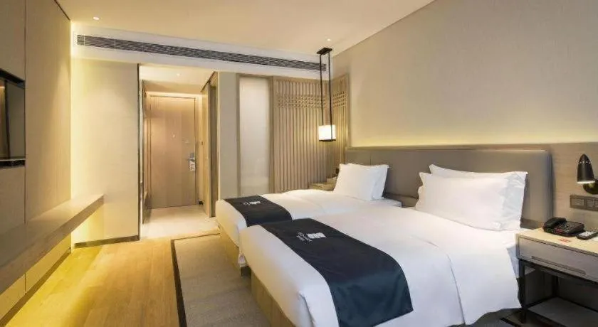Bed in Echarm Hotel Changsha Gaoqiao