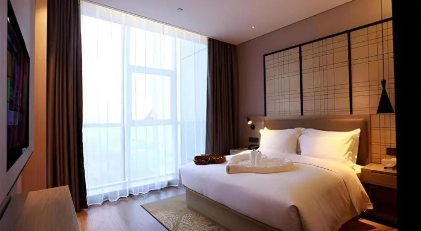 Bed in Echarm Hotel Changsha Gaoqiao