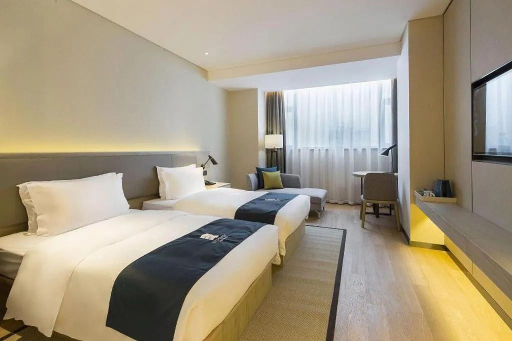 Bed in Echarm Hotel Changsha Gaoqiao