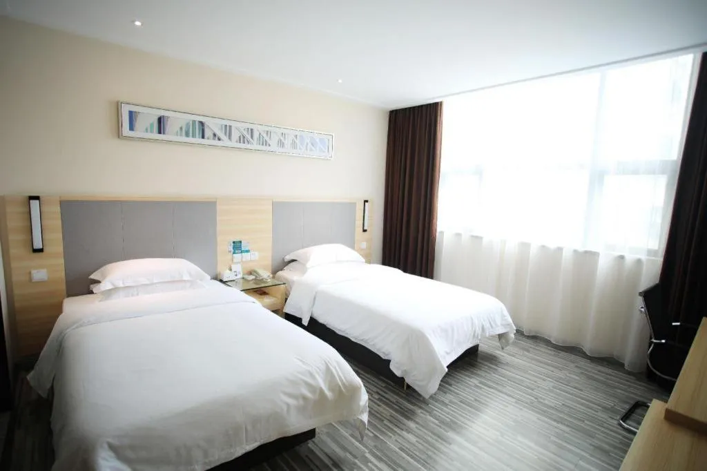 Bed in City Comfort Inn Fangcheng Qunxing Avenue