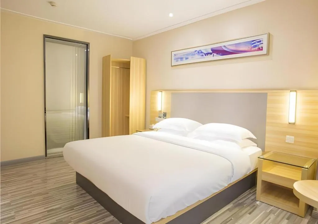 Bed in City Comfort Inn Fangcheng Qunxing Avenue