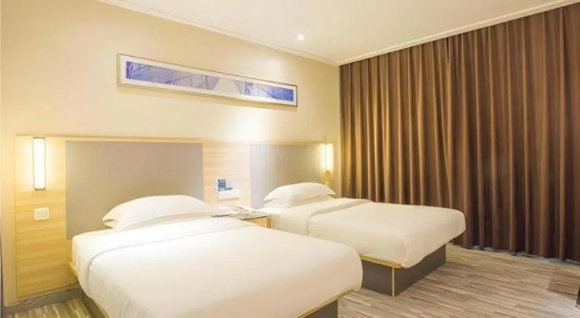 Bed in City Comfort Inn Fangcheng Qunxing Avenue