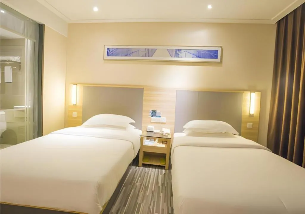 Bed in City Comfort Inn Fangcheng Qunxing Avenue