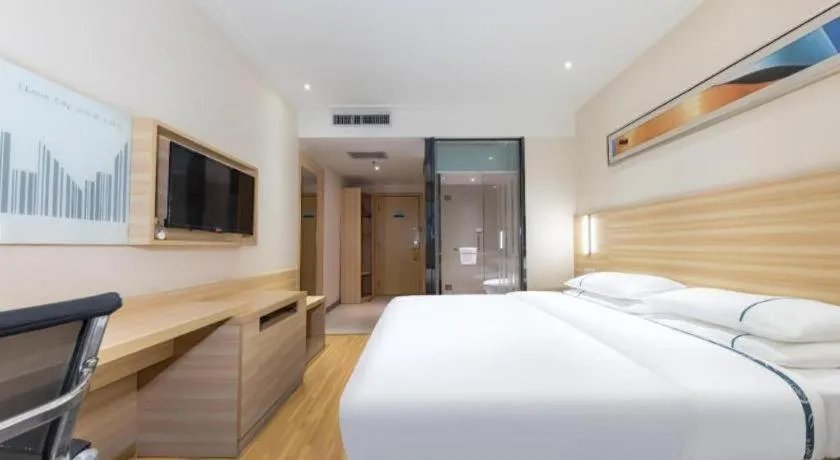 Bed in City Comfort Inn Jingmen Zhongjian Jinxiang Square