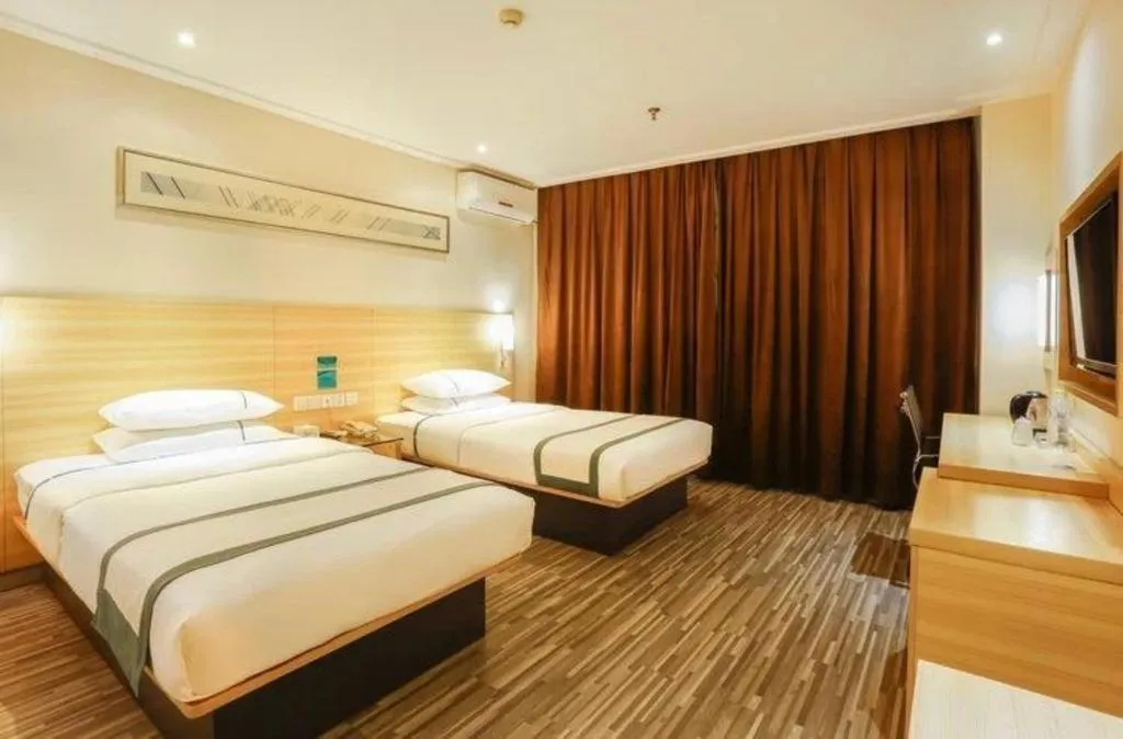 Bed in City Comfort Inn Deyang Shifang Yonghu Park