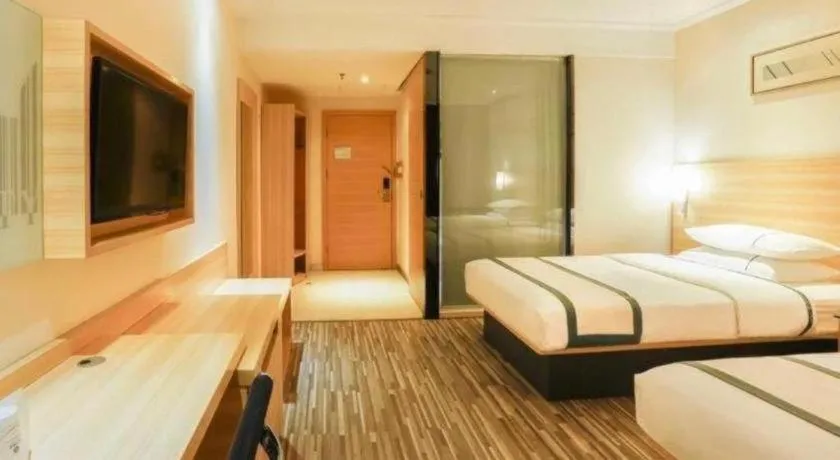 Bed in City Comfort Inn Deyang Shifang Yonghu Park