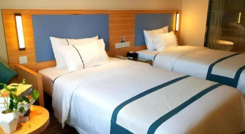 Bed in City Comfort Inn Deyang Shifang Yonghu Park