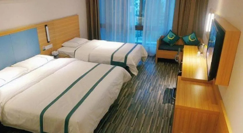 Bed in City Comfort Inn Deyang Shifang Yonghu Park