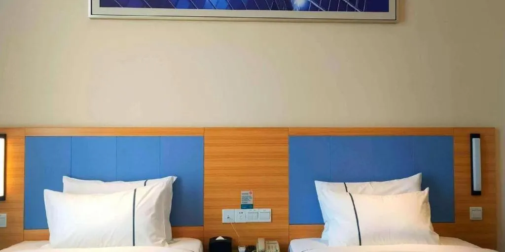 Bed in City Comfort Inn Deyang Shifang Yonghu Park