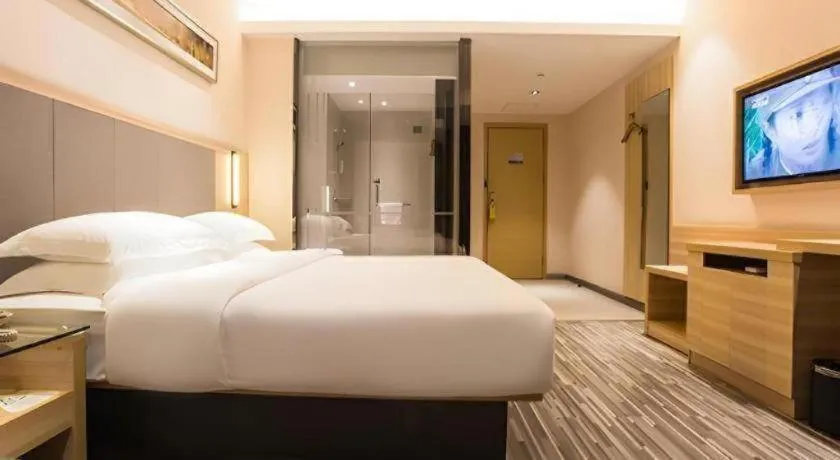 Bed in City Comfort Inn Wuzhou Arcade City Sanzongfu