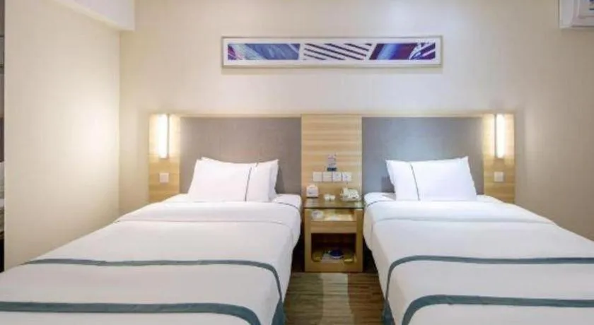 Bed in City Comfort Inn Wuzhou Arcade City Sanzongfu