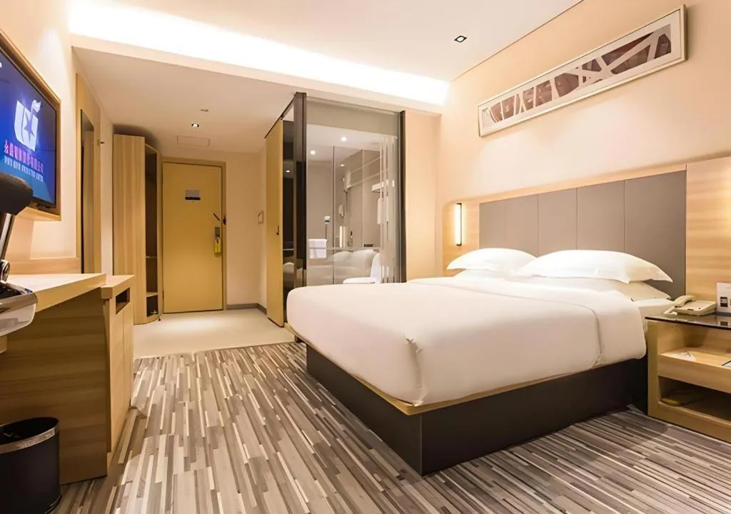 Bed in City Comfort Inn Wuzhou Arcade City Sanzongfu