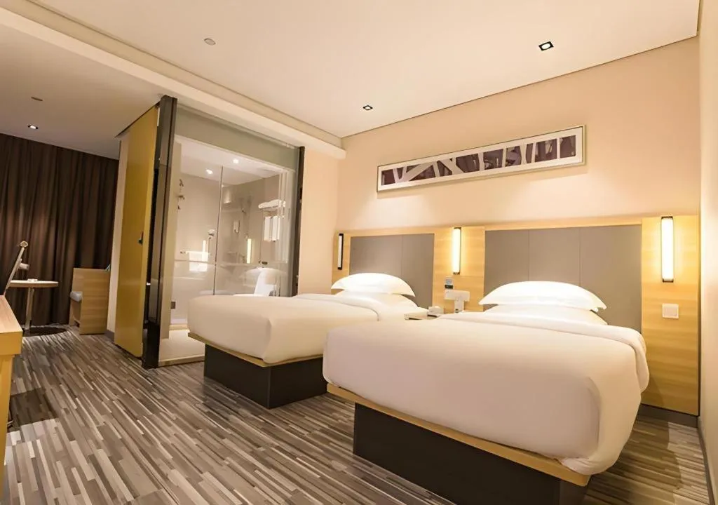 Bed in City Comfort Inn Wuzhou Arcade City Sanzongfu