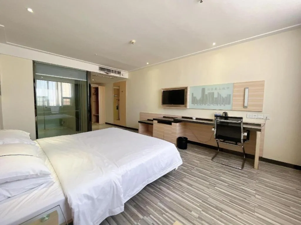 Bed in City Comfort Inn Huanggang Dongmen Road Wanda Plaza