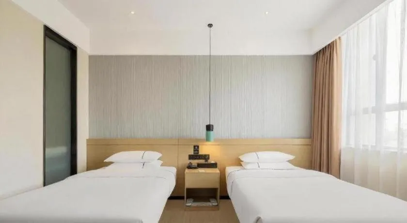 Bed in City Comfort Inn Hainan Tunchang Changsheng Road