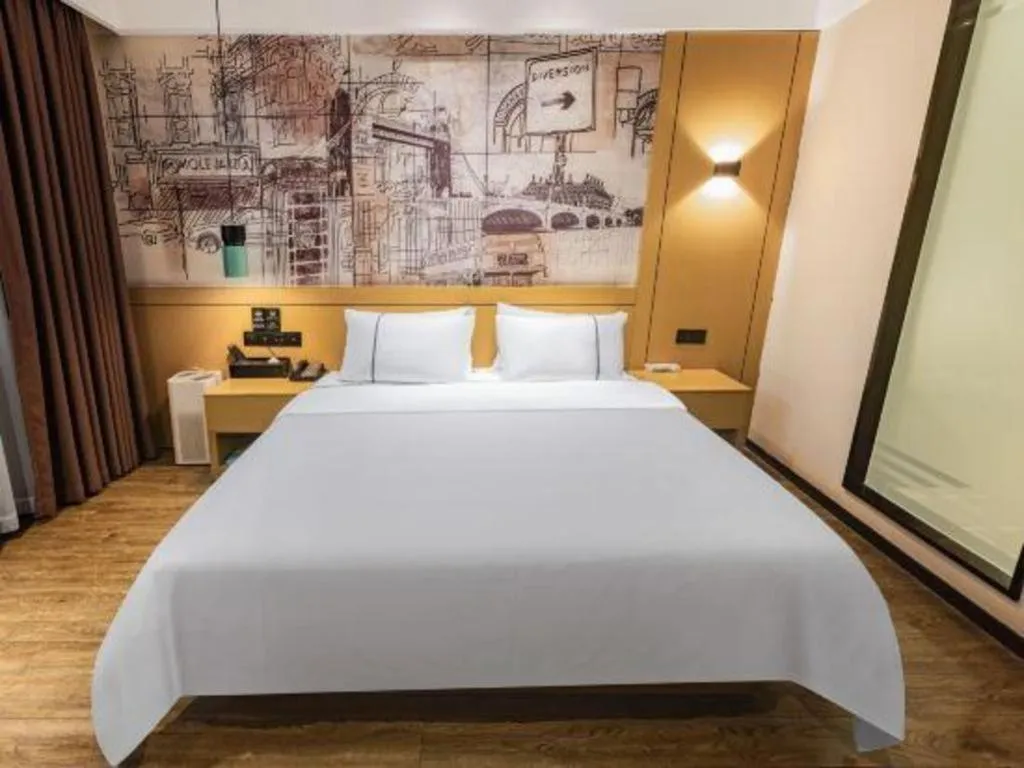 Bed in City Comfort Inn Meishan Wanda Plaza