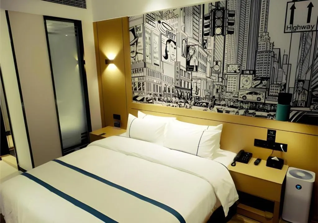 Bed in City Comfort Inn Meishan Wanda Plaza