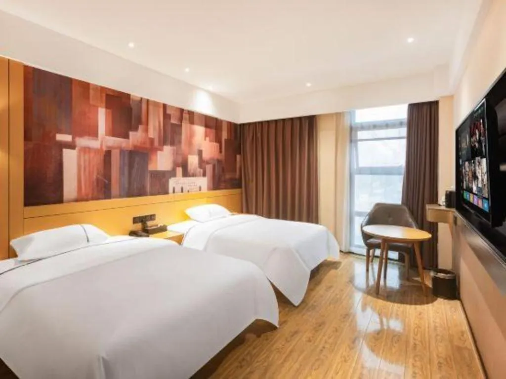 Bed in City Comfort Inn Meishan Wanda Plaza