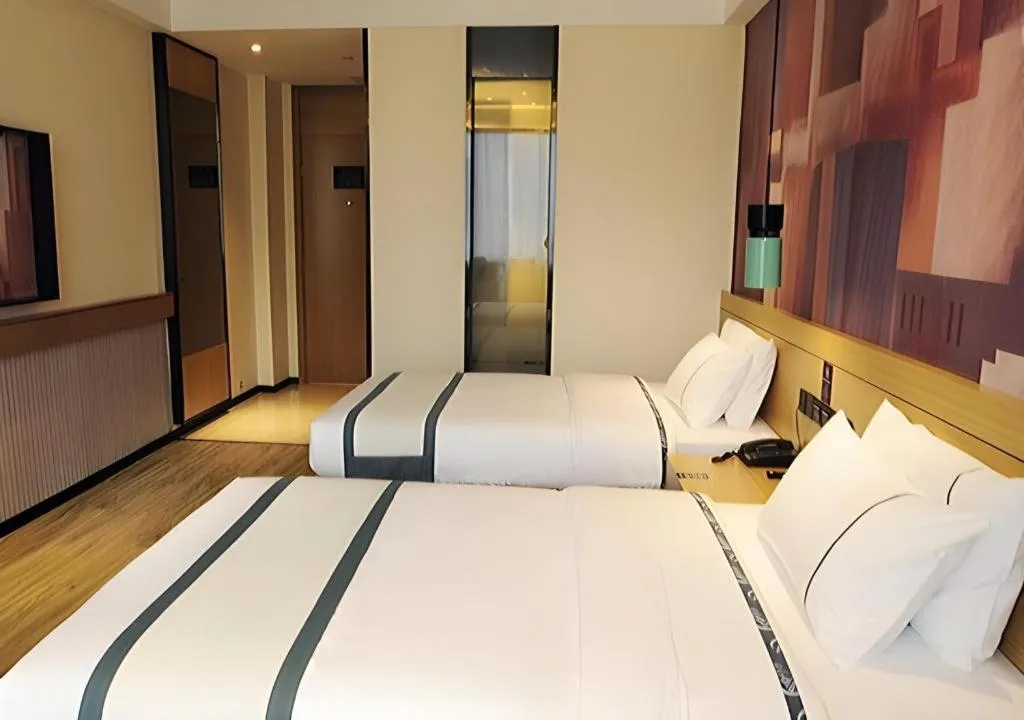 Bed in City Comfort Inn Suizhou Bingzi Wanda