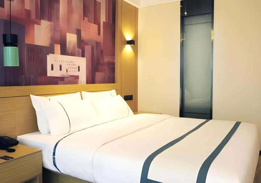 Bed in City Comfort Inn Suizhou Bingzi Wanda